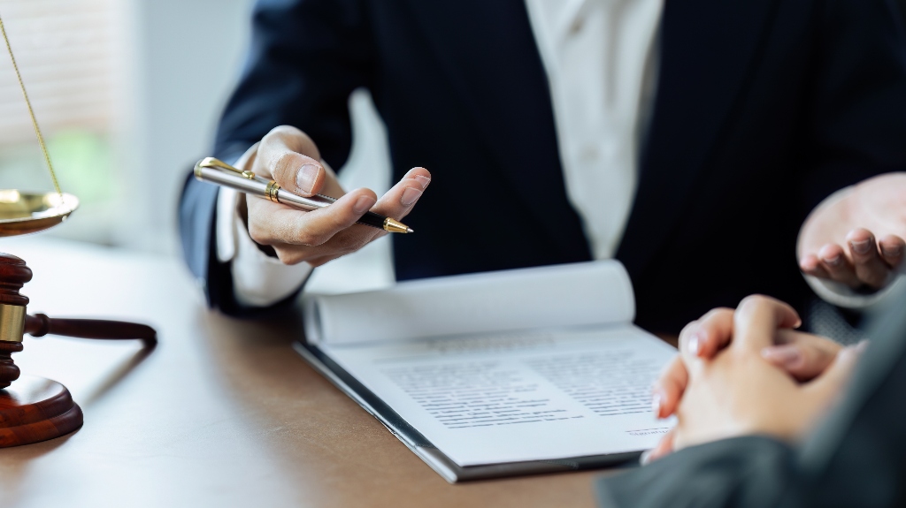 Client is listening to a lawyer advising, explaining the details of the proceeding