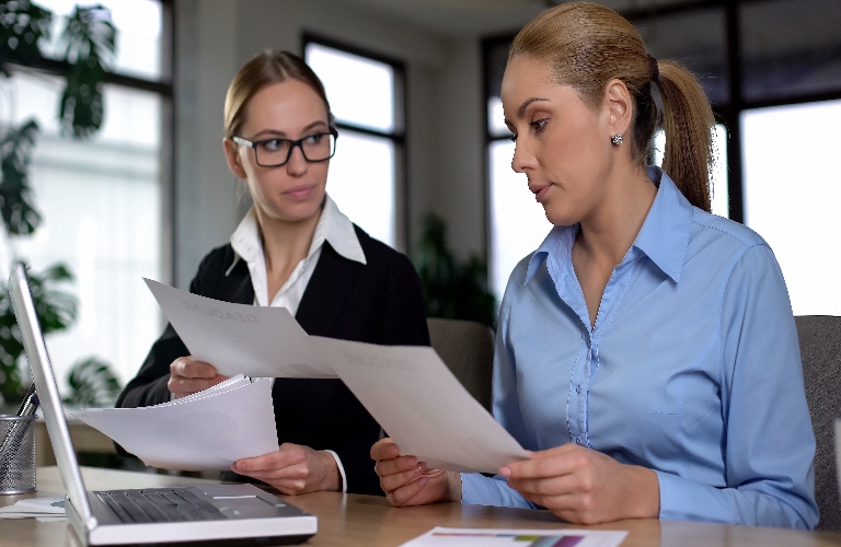 two women reviewing documents